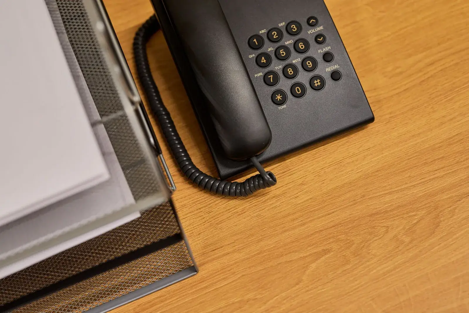 Vintage rotary telephone on a wooden surface