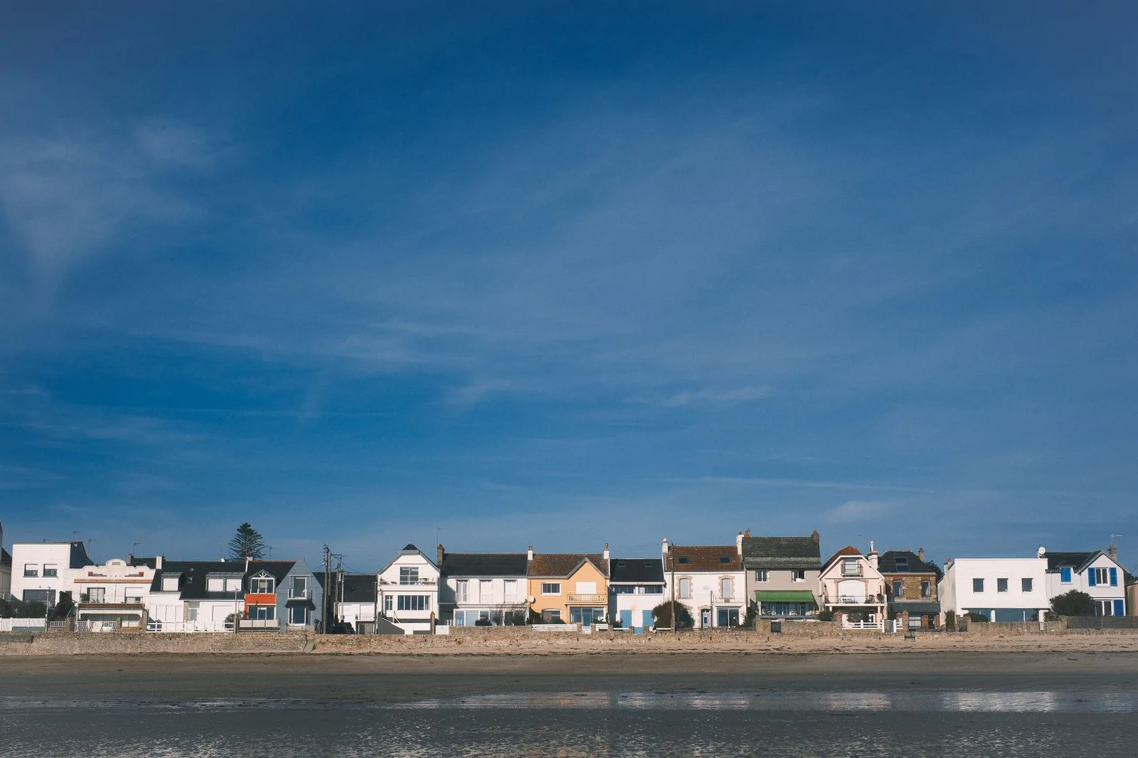 Beachfront houses under a clear sky