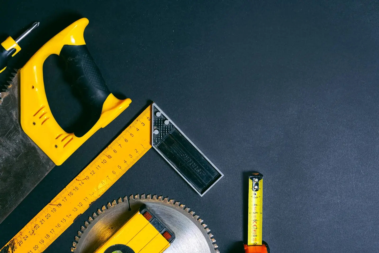 Job notes and a tape measure on a workbench