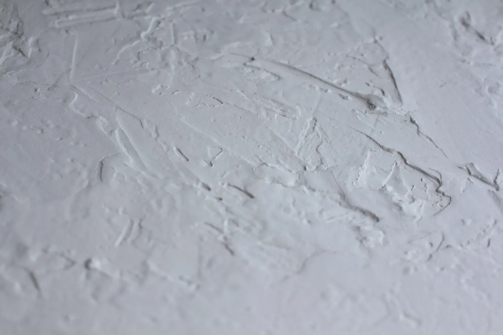 Wet plaster being smoothed on a wall
