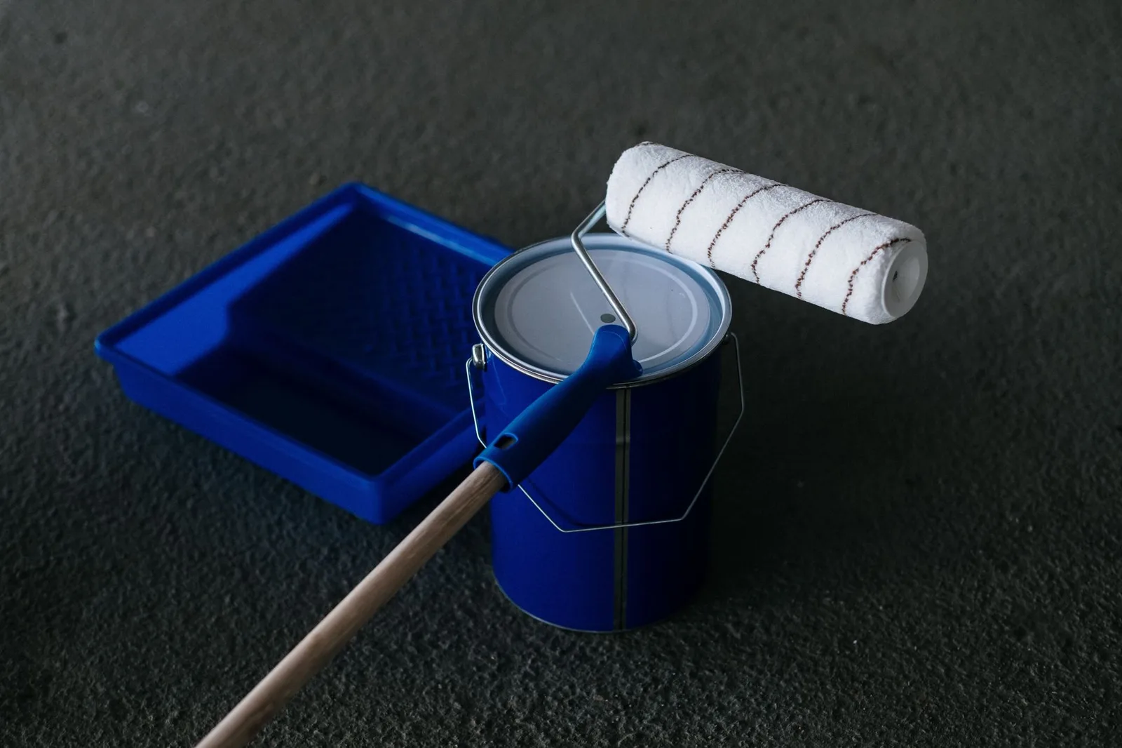 Paint roller and tray on an interior job
