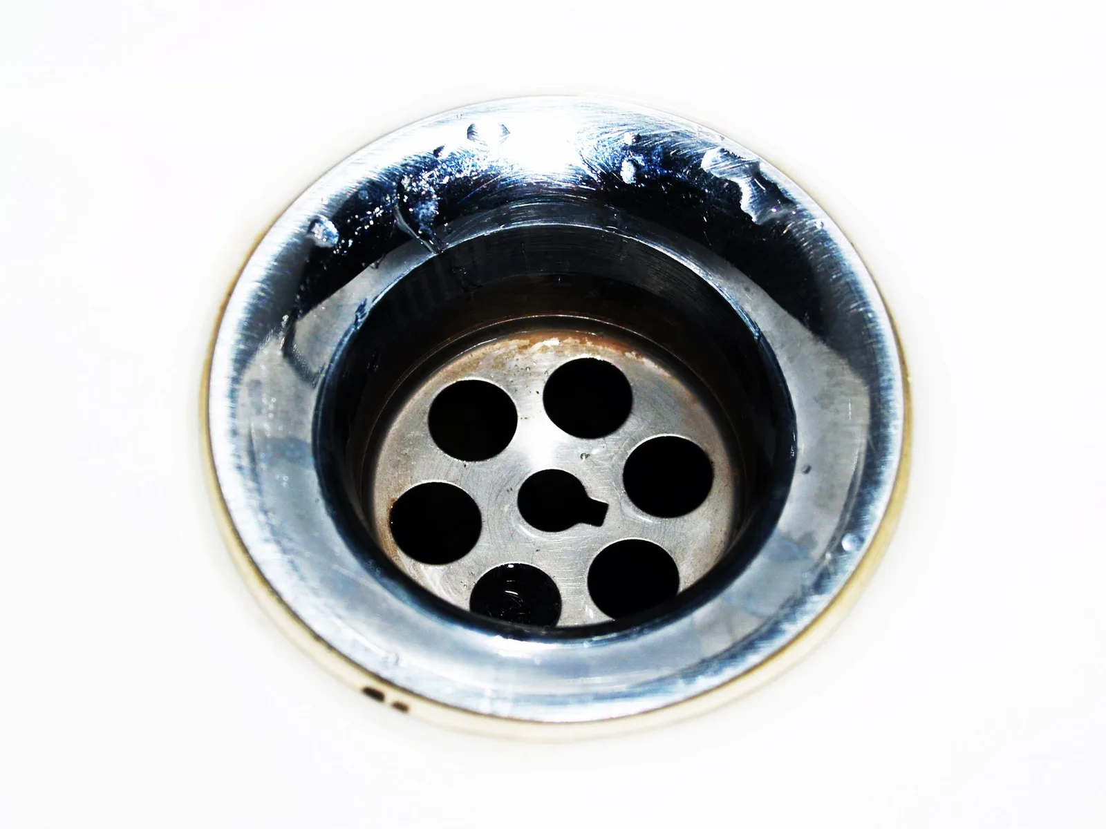 Pipe fittings and a trap under a bathroom sink